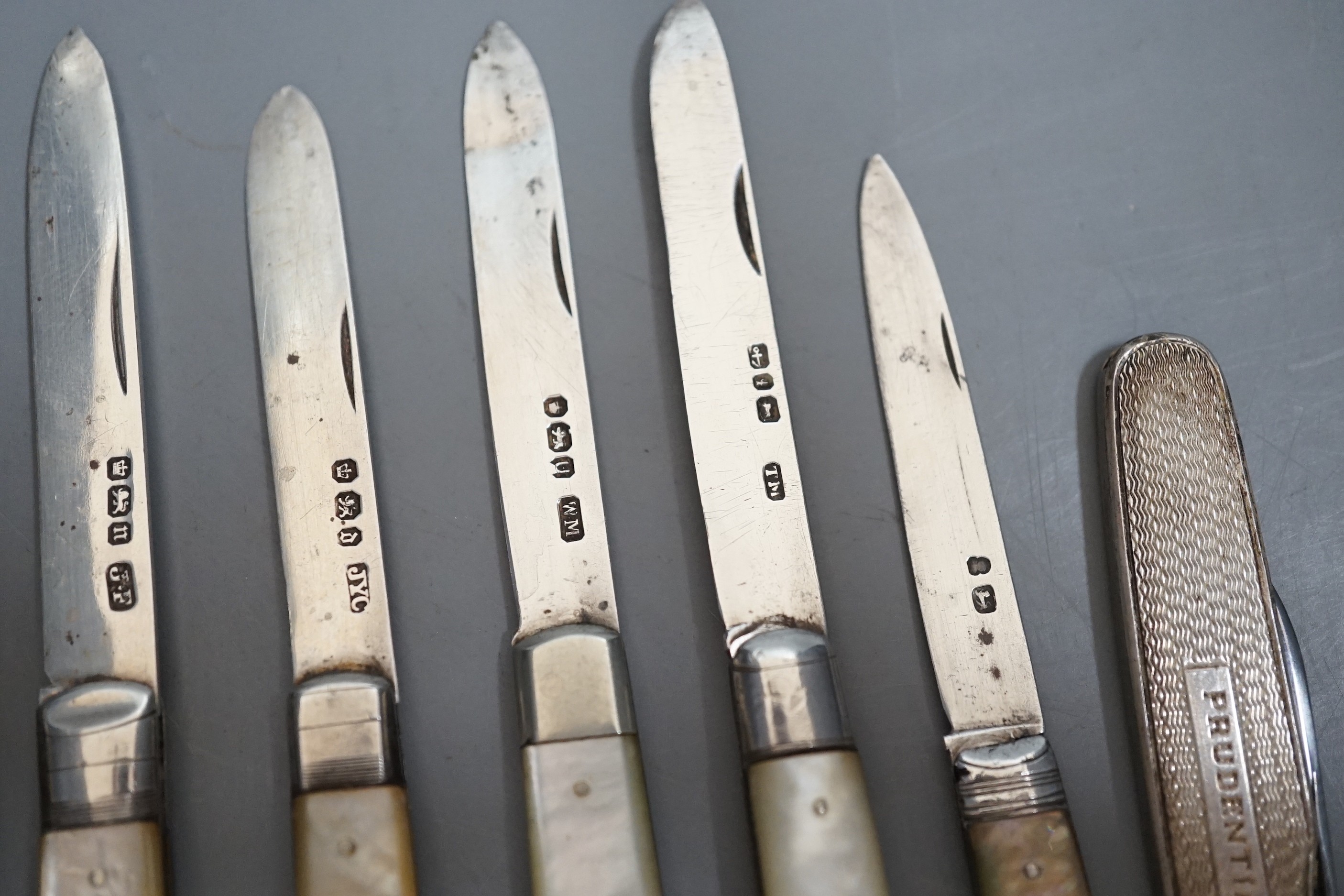 A collection of seven assorted mainly 20th century mother of pearl handled silver fruit knives and a silver cased pen knife.